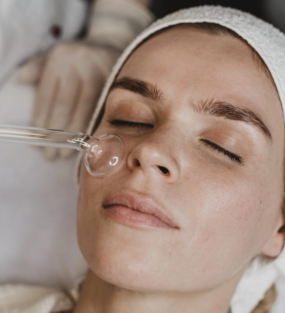 woman-getting-facial-skin-treatment-wellness-center
